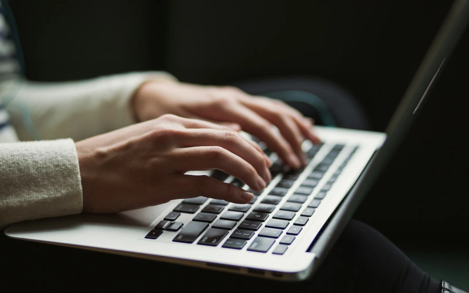 Writer editing an article on a laptop