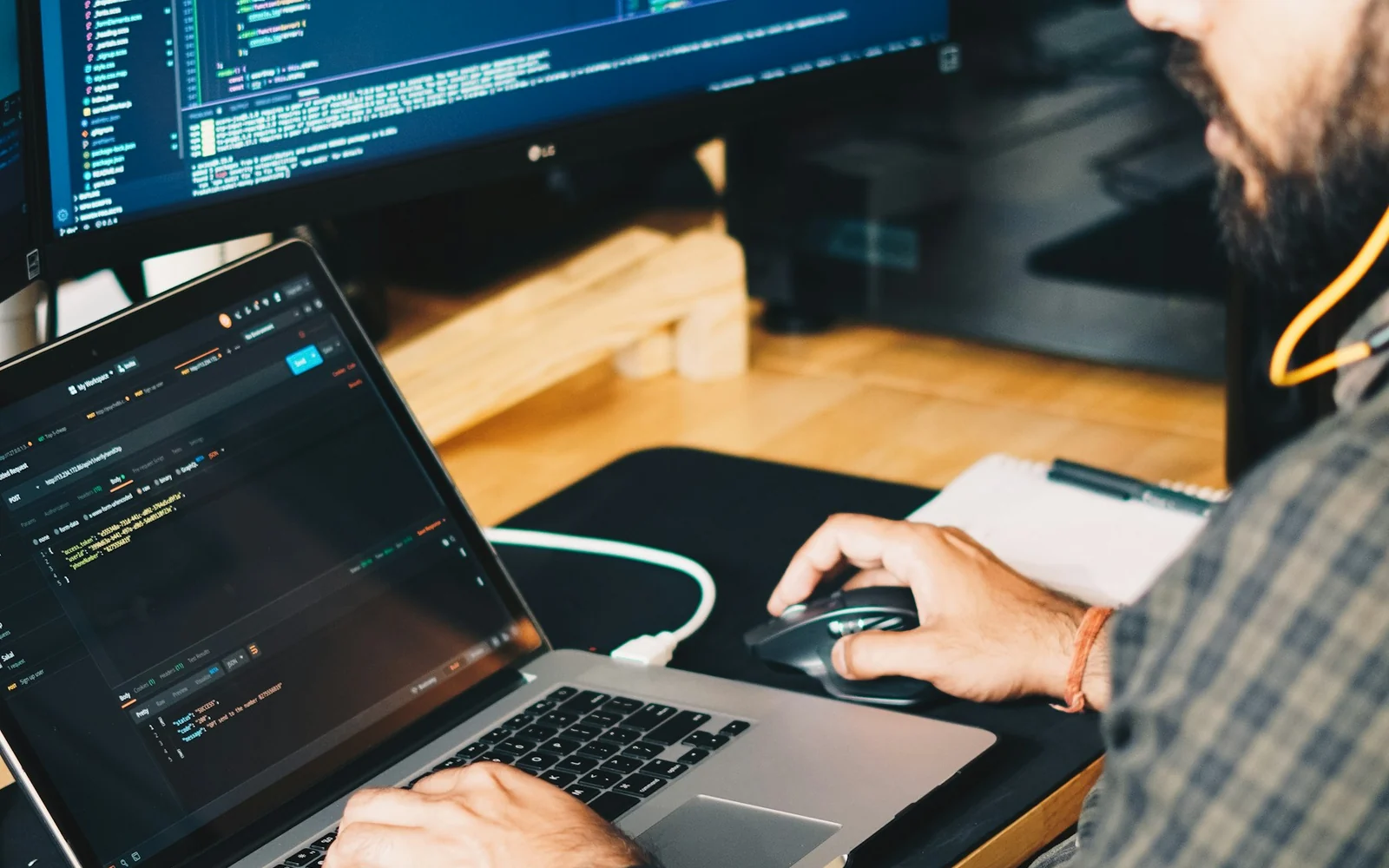 Developer reviewing a website on a laptop at a desk